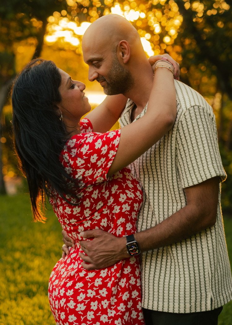 Krishna and Harsh embracing in golden evening light